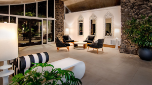 hotel lobby with seating area, mirrors, and glass doors